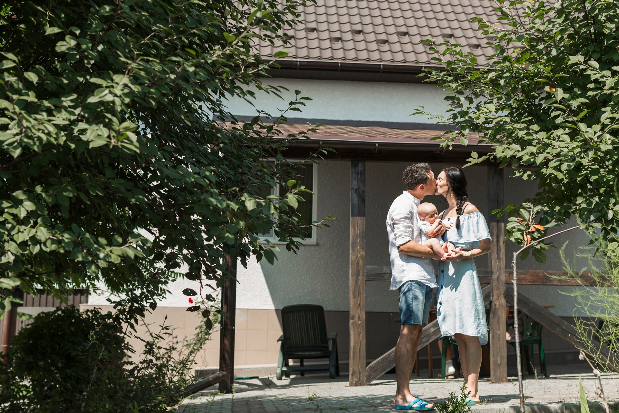 Family standing in front of their home.